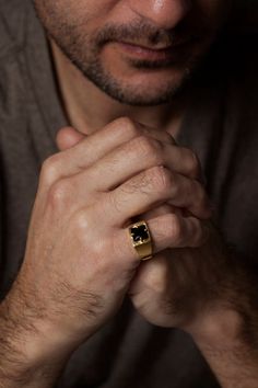 Bold and so rich looking, this 14k gold men’s ring features a faceted genuine black onyx gemstone as its focal point. The wide band adds to its boldness and it slightly tapers in the back for comfort. I gently brush the gold for added texture, plus it works so well with the black onyx stone. The black onyx measures 8mm x 8mm. Comes in a handsome black alligator print gift box. FREE shipping worldwide. Handmade in Israel.✦ Handmade in real 14k gold.✦ Genuine black onyx gemstone. ✦ Comes in a gift Black Onyx Ring Gold, Guy Jewelry, Large Gold Ring, Man Rings, Onyx Ring Men, Boyfriend Valentines, Unique Mens Rings, Black Alligator, Gold Bridal Jewellery Sets