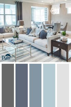 a living room filled with furniture and lots of gray color scheme in shades of blue