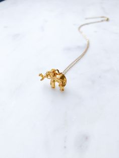 "ABOUT THIS PIECE:  Handcrafted, limited edition necklace, entailing a detailed gold Elephant charm (approximately 1/2\" in height and 3/4\" in width) 16\" long with a 2\" extender. 14k gold vermeil, which is a tarnish resistant material that has a 925 sterling silver base metal and is coated in 2.5 micron thickness of 14k gold. This listing is for the necklace shown in the first few photos.  I also have matching earrings and bracelets as shown in the last few pictures. Here are the links: Brace Gold Brass Jewelry For Anniversary Gift, Gold Charm Jewelry For Anniversary Gift, Spiritual Gold Necklaces For Anniversary Gift, Gold Jewelry With Charms For Anniversary Gift, Nickel-free Gold Jewelry For Anniversary, Gold Spiritual Necklace For Anniversary Gift, Gold Plated Necklace For Anniversary Gift, Gold Brass Charm Necklace For Gift, Nickel-free Gold Necklace For Wedding