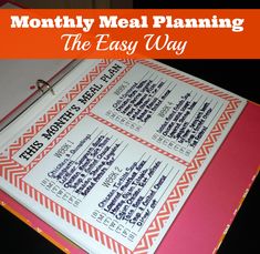 a pink and red book with the title, how to make a meal planner