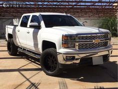 a white truck parked in front of a building