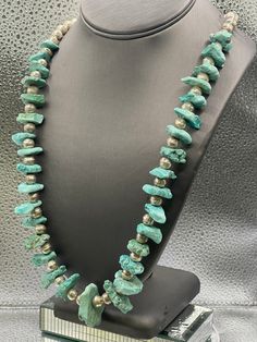 A fabulous example of South Western/Mexican design.  A perfect piece of jewelry for a woman or man.  Designed with sterling silver balls set between each Turquoise nugget. A unique necklace for all occasions.   Weight-106.0 grams Length-25.0 Our Price 198.00 Regularly Priced At $300.00 Please See Our Video Remember - If you're purchasing for yourself or a gift for a loved one, buy with confidence.  We Guarantee Everything We Sell!  SKU # N701 Southwestern Silver Turquoise Necklace With Gemstone Beads, Artisan Sterling Silver Turquoise Necklace With Polished Beads, Artisan Turquoise Necklace With Polished Sterling Silver Beads, Unique Turquoise Necklace With Polished Beads, Silver Turquoise Necklace With Round Gemstone Beads, Turquoise Natural Stones Necklace For Collectors, Collectible Turquoise Necklaces With Natural Stones, Artisan Silver Turquoise Necklace With Gemstone Beads, Artisan Turquoise Necklace With Silver Gemstone Beads