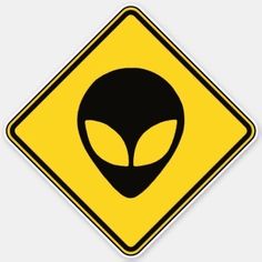 an alien crossing sign is shown in black and yellow with the image of an alien on it's face