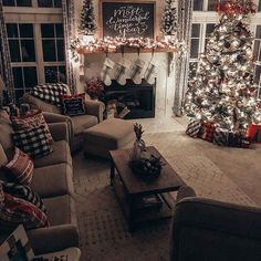 a living room filled with furniture and a christmas tree