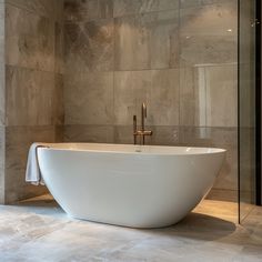 a large white bath tub sitting inside of a bathroom