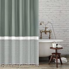 a bathroom with a bathtub and shower curtain