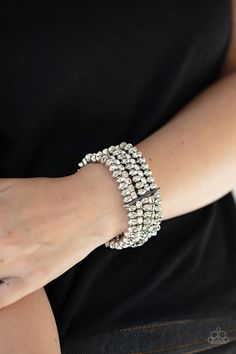 Held together with a sleek silver fitting, edgy rows of faceted silver beads and glittery white rhinestones are threaded along stretchy bands around the wrist, creating glamorous layers. Paparazzi Accessories Jewelry, Infinity Wrap, Bracelet Set Silver, Coil Bracelet, Nickel Free Jewelry, White Bracelets, Paparazzi Accessories, Dainty Bracelets, White Rhinestone