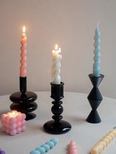 candles are arranged in different shapes and sizes