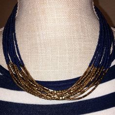 This Beautiful And Intriguing Navy Blue And Gold Multi Strand Seed Bead Necklace Is An Incredible Piece To Own. Nwt, Brand New, Just Waiting For You! Blue Multi-strand Jewelry With Gold Beads, Blue Multi-strand Necklace With Gold Beads, Party Blue Necklaces With Gold Beads, Blue Necklaces With Gold Beads For Beach, Navy Blue And Gold, Seed Bead Necklace, Multi Strand Necklace, Blue And Gold, Strand Necklace