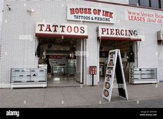 the outside of a tattoo and piercing shop