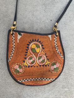 Make this fabulous embroidered black leather crossbody yours.100% Genuine LeatherBeautiful embroideryHeight with strap at longest: 32”Height without strap: 8.75”Width: 9.5” Black Embroidered Shoulder Bag For Festivals, Black Shoulder Bag For Everyday Use And Festivals, Black Shoulder Bag For Everyday And Festivals, Embroidered Brown Crossbody Shoulder Bag, Brown Embroidered Crossbody Shoulder Bag, Multicolor Embroidery Crossbody Shoulder Bag, Leather Shoulder Bag With Floral Embroidery, Festival Crossbody Shoulder Bag With Hand-stitched Details, Festival Crossbody Shoulder Bag With Hand-stitching