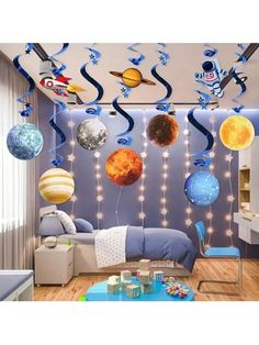 a room with planets hanging from the ceiling