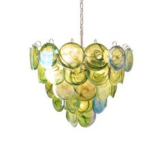 a multi - colored glass chandelier hanging from a chain on a white background