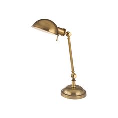 an antique brass desk lamp on a white background