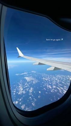 an airplane wing is seen through the window