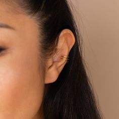 Our Claw Hoop Ear Cuff is a graceful, yet edgy interpretation of a classic ear cuff. This dainty and minimalistic piece can be worn alone or stacked with other earrings for additional style. Material: High Quality Solid 925 Sterling Silver Finish: Sterling Silver ∙ 18K Gold Featuring 9.5mm Inner and 12.5mm Outer Cuff Earrings Sold as a pair SKU: RR-ER274 Adjustable Single Ear Cuff For Everyday Wear, Adjustable Single Ear Climber For Everyday Wear, Adjustable Minimalist Hoop Ear Cuff, Minimalist Pierced Adjustable Ear Cuff, Minimalist Adjustable Pierced Ear Cuff, Adjustable Huggie Ear Cuff With Ear Wire, Adjustable Minimalist Huggie Wrap Earrings, Minimalist Adjustable Huggie Wrap Earrings, Adjustable Tarnish Resistant Ear Cuff For Everyday