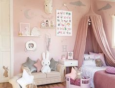 a child's bedroom decorated in pink and white