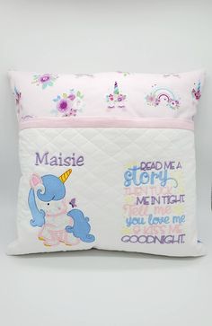 a pillow with an elephant and unicorn design on the front, along with some words