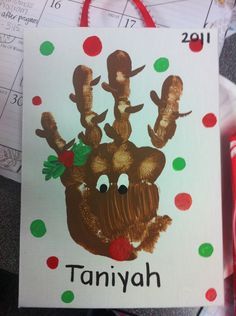 an image of a handprinted christmas card with the name taniyah on it