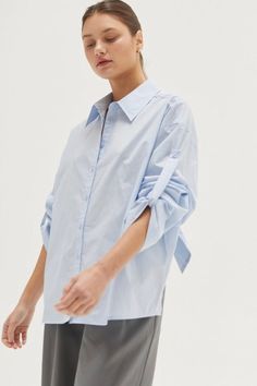 Evie Tie Back Poplin Shirt 100% COTTON -Button front placket -Poplin shirt -Tie back detail -Wide cuffed sleeve hem Model height is 5'9" wearing a small size S