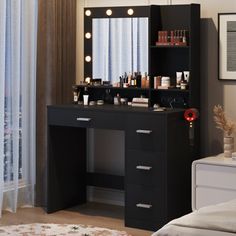 there is a vanity with lights on the mirror and drawers in front of it,