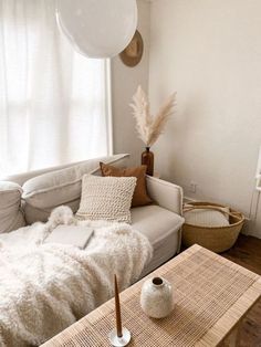 a living room filled with furniture and pillows