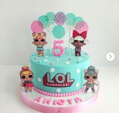 the birthday cake is decorated with lol surprise dolls and balloons on it's top