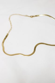 Lola Gold Herringbone Snake Chain Choker Necklace wraps perfectly around the neck and lobster claw closure. This item is currently sold out at the moment, it will take 1-2 weeks to make. Please pre-order now! Don't worry, we will keep you in the loop and message you when it is ready to ship! Thank you! ◊ 18K Gold Plated Over Brass ◊ Short length: 31 cm + 10 cm extension ◊ Long length: 38cm + 10 cm extension ◊ Chain measures 3mm wide ◊ The chain feels very lightweight and easy to wear ◊ Lobster c Delicate Metal Snake-shape Chain Necklace, Gold Herringbone Necklace With Adjustable Chain, Gold Plated Snake Shaped Necklace With Adjustable Chain, Gift Herringbone Necklace With Delicate Metal Chain, Dainty Gold Herringbone Necklace, Gold Snake Shape Chain Necklace Gift, Snake Shape Gold Chain Necklace Gift, Minimalist Snake Shape Necklace With Adjustable Chain, Gold Snake Chain Choker As A Gift