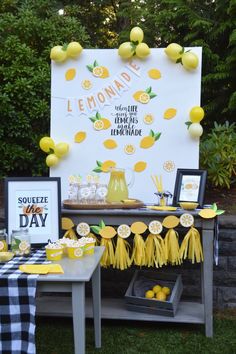 a lemon themed birthday party with lemons and lemonade on the table, lemon decorations