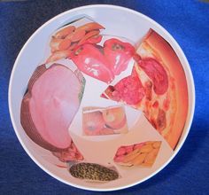 a white plate topped with different types of food on top of a blue table cloth