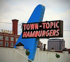 a large blue sign that says town - topic hamburgers