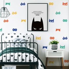 a bedroom with batman wall decals on the walls