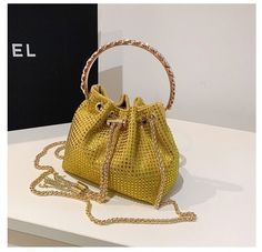 Trendy and Colorful: Women's Diamante Chain Tassel Crossbody Bucket Bag - Julie bags Summer Party Bags With Chain Detail, Trendy Gold Rectangular Bucket Bag, Yellow Shoulder Bag With Chain Strap For Party, Trendy Shoulder Bag With Chain Strap For Event, Yellow Party Shoulder Bag With Chain Strap, Trendy Yellow Evening Bag, Chic Yellow Party Bag, Party Crossbody Bucket Bag With Chain Strap, Yellow Crossbody Bag For Party