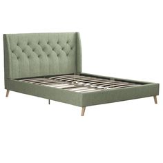 the bed frame is upholstered with buttons