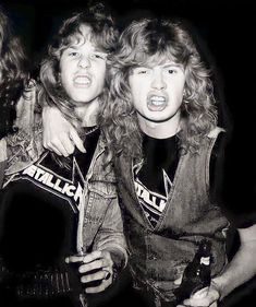 three young men with long hair are posing for the camera