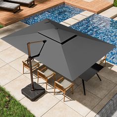 an overhead view of a table and chairs near a pool with a large umbrella over it