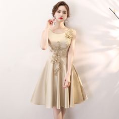 Sleeveless dresses, elegant short bridesmaid dresses, gold homecoming dressesMaterial:satinColor:as picture or custom colorNeckline:o-neckBack details:bandageDress type:A-lineStyle:elegant&ltp&gtFeatures:applique</p>&ltbr/>&ltp&gtThis dress could be custom made, there are no extra cost to do custom size and color.</p>&ltbr/>&ltp&gt1, If the color is customized, please note the color & card number.</p>&ltbr/>&ltp&gt2,You c Gold Satin Sleeveless Evening Dress, Gold Satin Evening Dress For Prom, Gold Satin Prom Evening Dress, Elegant Gold Sleeveless Dress For Prom, Gold Satin Evening Dress For Banquet, Gold Satin Sleeveless Dress For Wedding, Gold Sleeveless Satin Dress For Wedding, Gold Satin Dress For Prom Season, Elegant Gold Sleeveless Wedding Dress