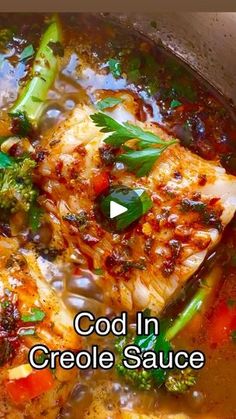 cooked fish and vegetables in a pot with the words cold in crocke sauce