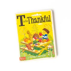 a children's book with the title t is for thanksgiving