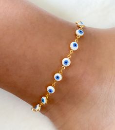 Evil eye anklet bracelet Beautiful and delicate anklets you can match with any outfit and wear everyday! MATERIAL AND SIZE 18k gold plated eye chain Enamel eyes Anklet length 23.5cm If you have questions about the product, feel free to reach me out. Don't forget to check out my other items in the store: Https://www.etsy.com/shop/nyahwithlove Metal Evil Eye Bracelet For Gift, Evil Eye Metal Bracelet Gift, White Metal Anklet Perfect For Gifting, Handmade Trendy Gold Anklets, White Metal Anklet As Gift, White Metal Anklets For Gift, Trendy Handmade Gold Anklets, Trendy Evil Eye Jewelry For Festivals, Handmade Trendy Evil Eye Bracelet