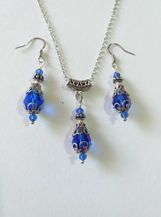 Victorian Silver Blue jewelry set Cobalt blue set necklace earrings Baroque jewelry set Boho set Silver set Vintage Royal style set Antique style jewelry set Victorian jewelry Silver Blue Victorian set necklace earrings Bohemian necklace and earrings . Beautiful Set of silver-tone Antique style Cobalt blue faceted teardrop shaped glass beads and fine little blue crystals necklace and earrings. Silver  tone pendant Victorian style necklace and earrings. Boho necklace. Bohemian necklace and earrings. Romantic necklace and earrings. Royal style jewelry set. Baroque style jewelry set. Antique style jewelry set. Gothic style jewelry set. Royal blue jewelry set. Crystal blue jewelry set. Perfect Gift for girlfriend,  mother,  sister,  bridesmaids or Maid of honor. Gift for special people or jewe Silver Blue Jewelry, Royal Blue Jewelry, Baroque Jewelry, Antique Style Jewelry, Blue Jewelry Set, Blue Drop Earrings, Blue Crystal Necklace, Romantic Necklace, Perfect Gift For Girlfriend