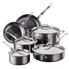 an assortment of pots and pans with lids