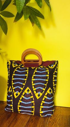 African printed Ankara Tote bags with wood handles. Bags are lined in canvas for durability  One of a kind prints. Great as gifts. These bags are handmade with love Wood Handles, Handmade Tote, Top Handle Bags, Wood Handle, African Print, Ankara, Purses And Handbags, Top Handle, Tote Bags