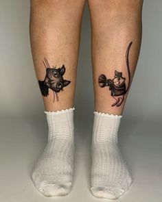 two people with tattoos on their legs, one has a mouse and the other has a fish