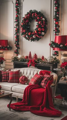 a living room decorated for christmas with red and green decorations