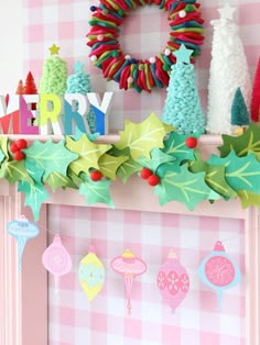 a christmas mantle decorated with paper decorations