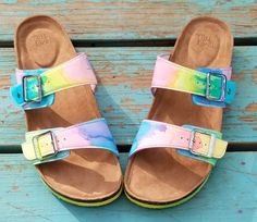 Be Soleful! Tie-Dye Birkenstock-style adjustable buckled slide sandals perfect for the hippie chick! Hand-painted with ecofriendly dye and made to order in women's sizes 6-11. Be super comfy and cute in these tie-dye slide sandals! **Half sizes not available** **Please note these are NOT the Birkenstock brand - they are made from high quality shoe that are just as cute and comfy** Multicolor Adjustable Sandals, Multicolor Adjustable Strap Sandals, Multicolor Summer Sandals With Adjustable Strap, Colorful Adjustable Sandals For Spring, Fun Adjustable Sandals For Spring, Adjustable Fun Sandals For Spring, Adjustable Buckle Closure Sandals For Festival, Casual Hand Painted Sandals For Summer, Casual Multicolor Hand Painted Sandals