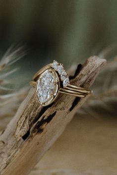 This diamond engagement ring is a beautiful ring to signify your love. Available in yellow, white, and rose gold. Perfect for the vintage, boho, or classic bride. #goldweddingring #diamondweddingring #diamondengagementring #weddingday #bohobride #vintagewedding #classicwedding Marquise Cut Halo Wedding Ring, Heirloom Marquise Diamond Ring With Prong Setting, Heirloom Cluster Ring With Marquise Cut Center Stone, Timeless Marquise Cut Halo Wedding Ring, 14k Gold Cluster Ring Marquise Cut For Wedding, Timeless 14k Gold Marquise Cut Wedding Ring, Timeless Marquise Halo Diamond Ring, Timeless Marquise Rings With Prong Setting, Heirloom Gold Diamond Ring With Marquise Cut