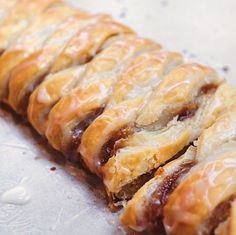 a pastry with icing sitting on top of a table