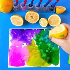 someone is painting with lemons and watercolors